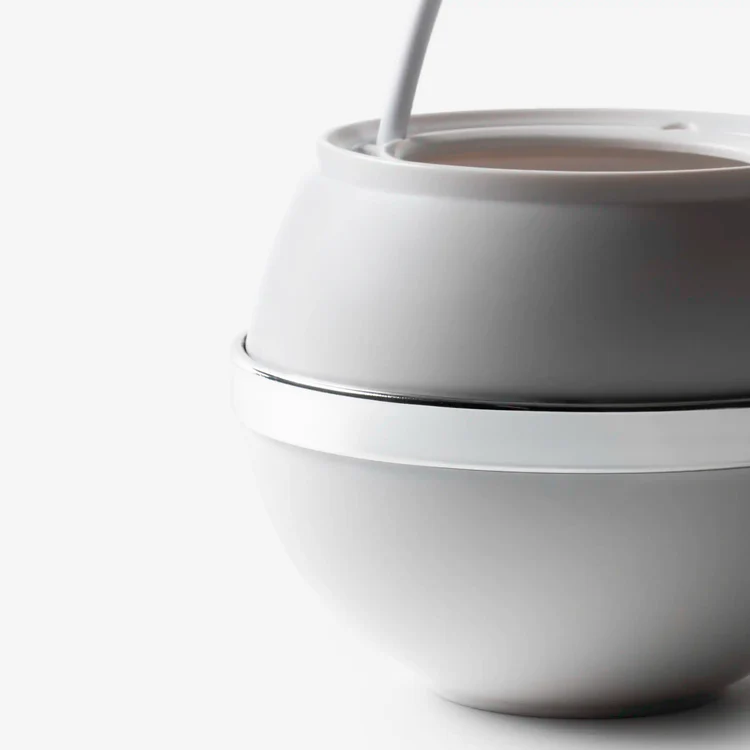 White ceramic bowl with pouring liquid
